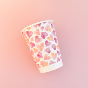 paper cup heart design on pink background