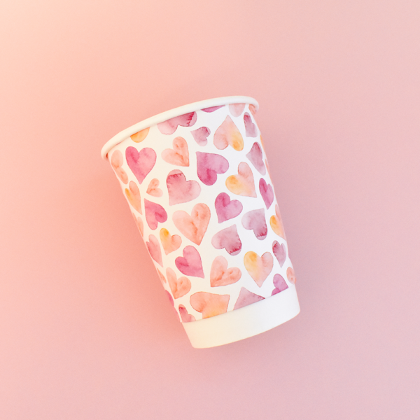 paper cup heart design on pink background