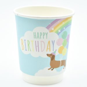 Paper cup featuring a pastel sausage dog design with clouds, rainbows, and sparkles – fun, colourful, and recyclable, ideal for parties or cafés.